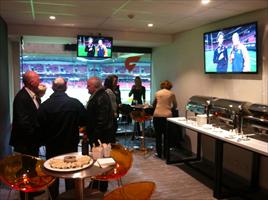 Hawkes Racing's clients enjoy the hospitality at the AFL football...