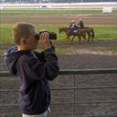 Charlie Holmes at the Flemington Jump Outs watching Observer