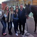 Leo Tsatsaronis and family with Federation Square catching up on all the gossip at Flemington